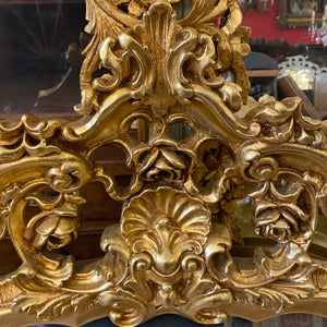 Antique French Gilt Mirror with Ornately Carved Details