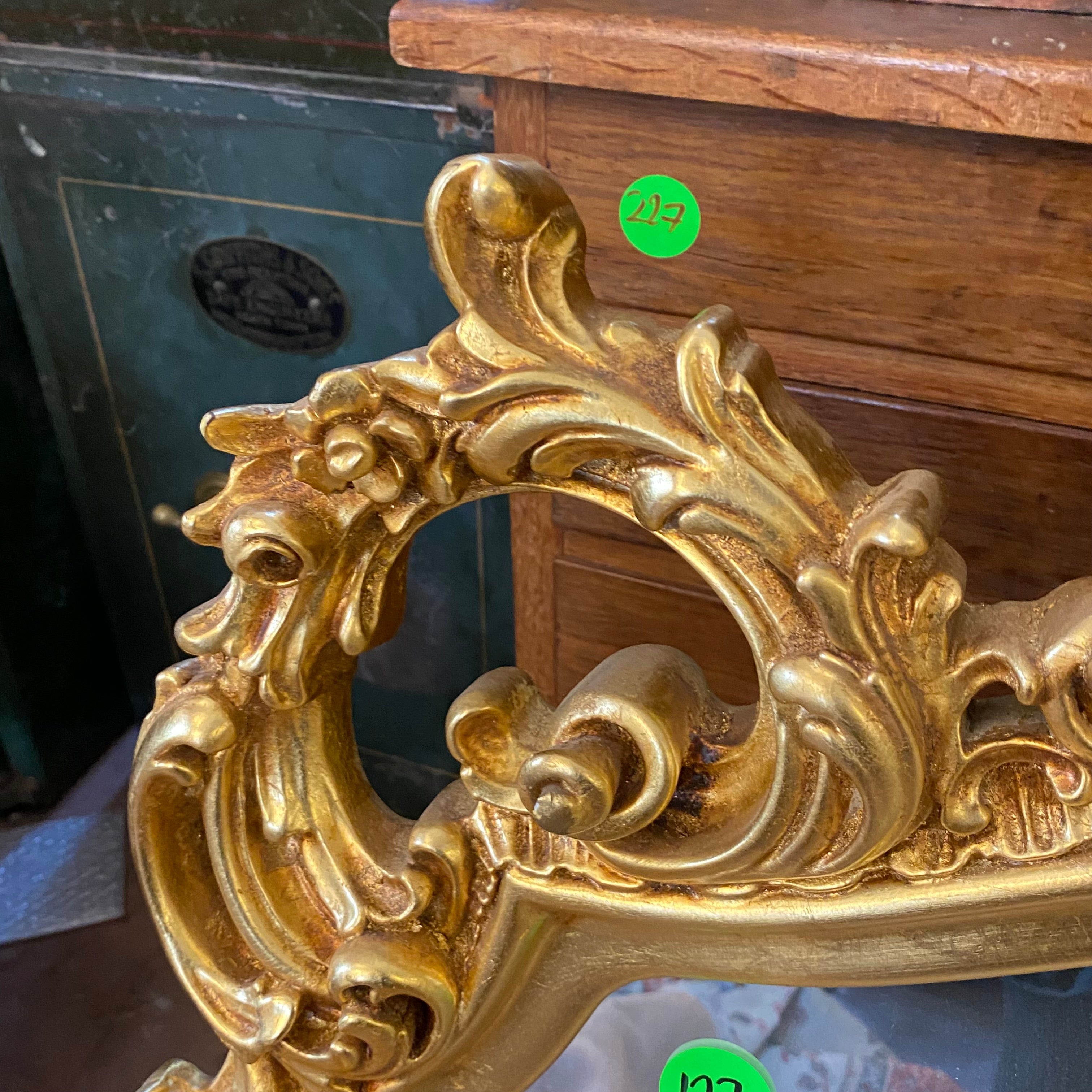 Antique French Gilt Mirror with Ornately Carved Details