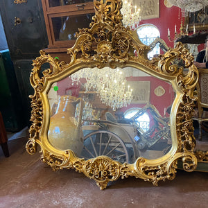 Antique French Gilt Mirror with Ornately Carved Details