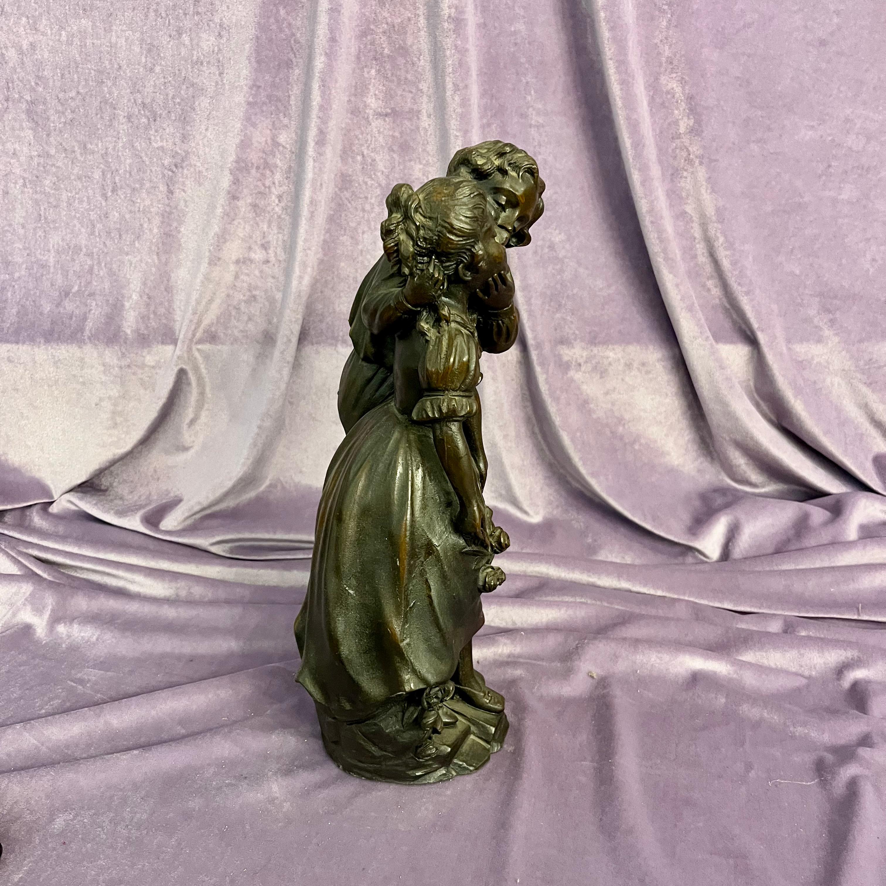 Antique Cast Statuette of Boy Kissing Girl