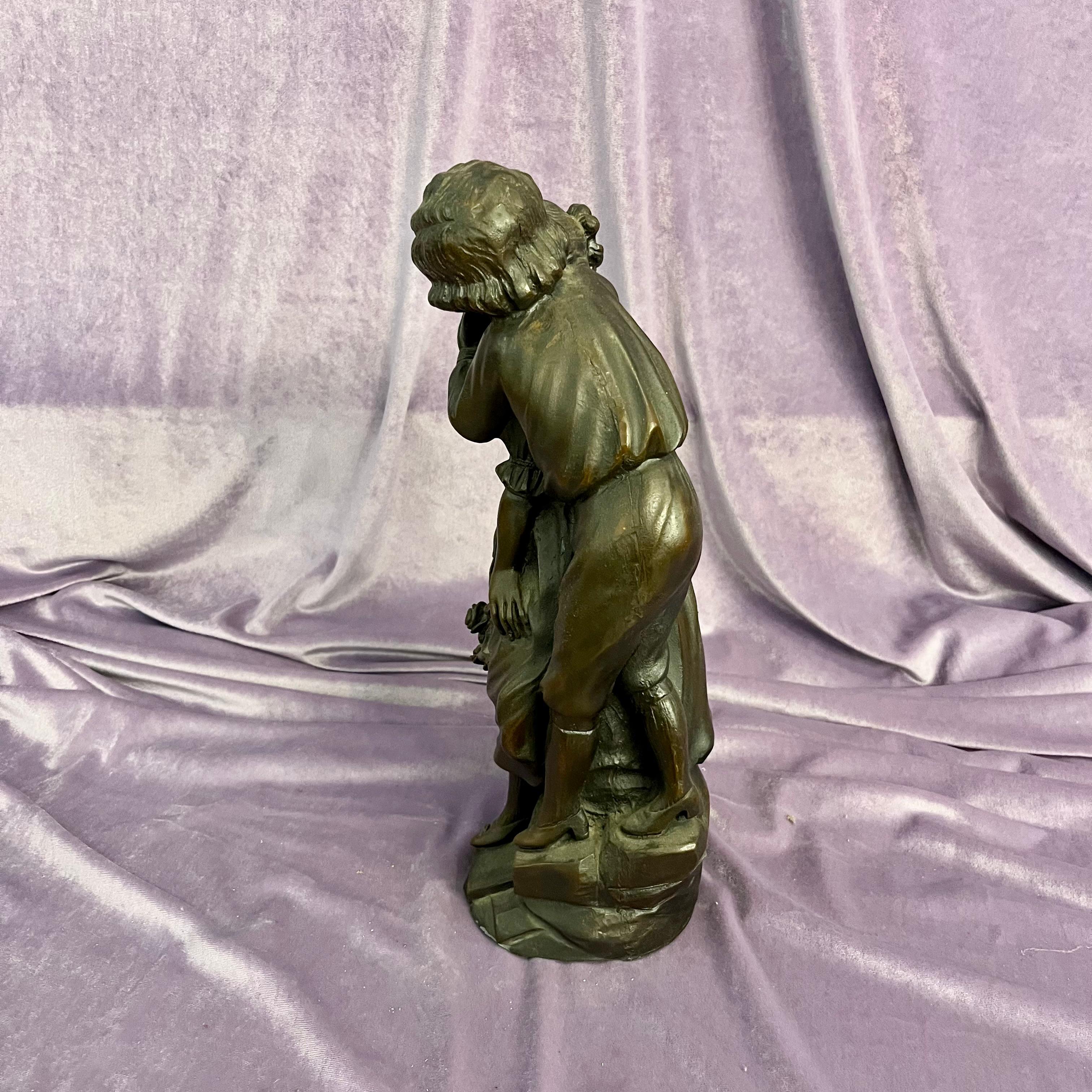 Antique Cast Statuette of Boy Kissing Girl