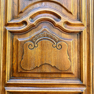 Antique Walnut Armoire with Intricate Carved Details