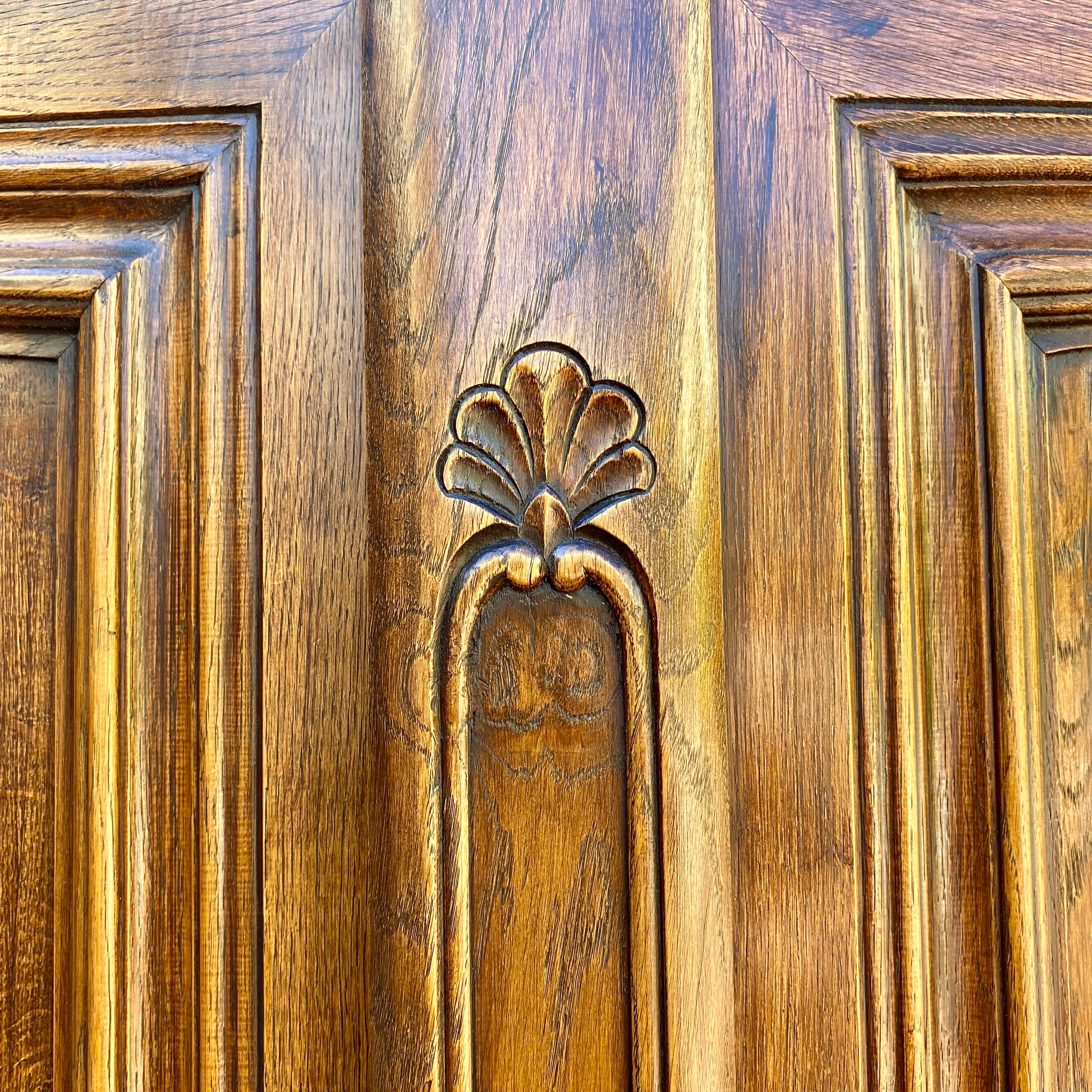 Antique Walnut Armoire with Intricate Carved Details