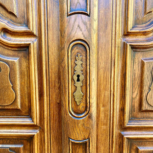 Antique Walnut Armoire with Intricate Carved Details