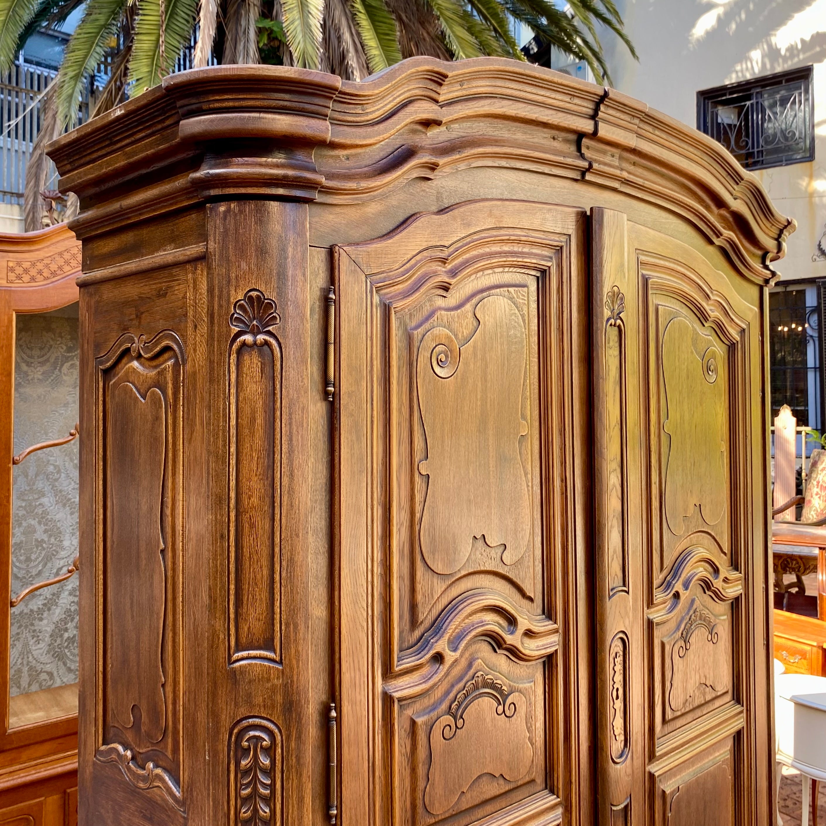 Antique Walnut Armoire with Intricate Carved Details