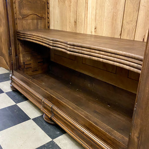 Antique Walnut Armoire with Intricate Carved Details