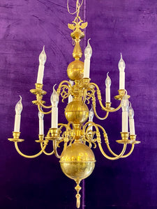 An Antique Polished Brass Double Tier Chandelier