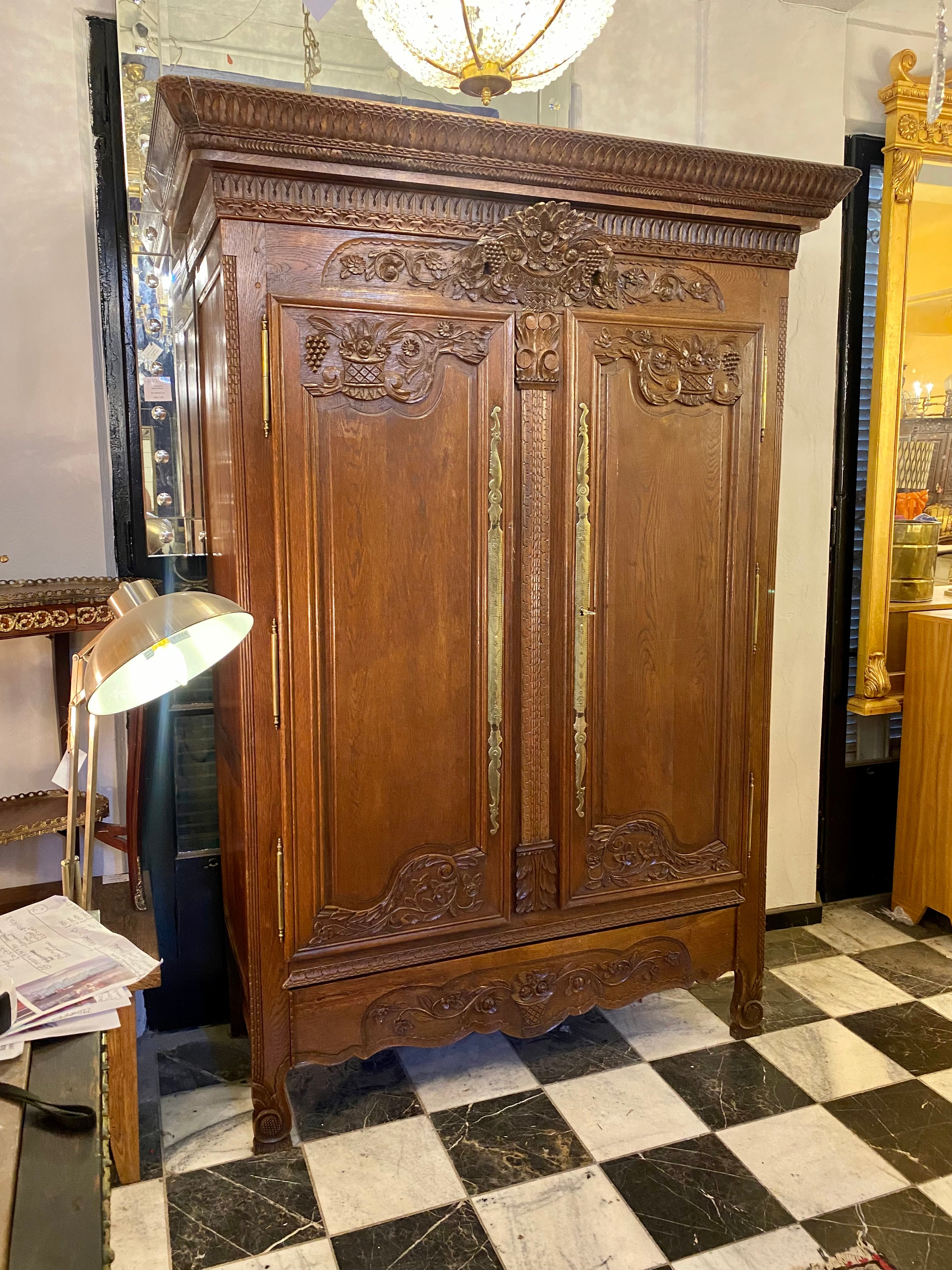 A 19th Century French Oak Wedding Armoire with Impressive Brass Escutcheons - SOLD