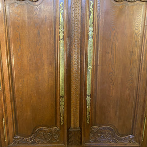 A 19th Century French Oak Wedding Armoire with Impressive Brass Escutcheons - SOLD