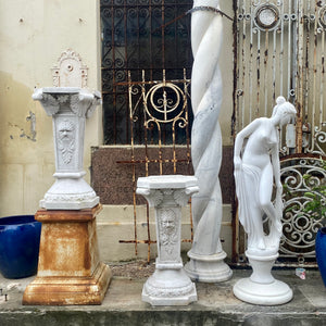 White Marble Plinths with Face of Zeus