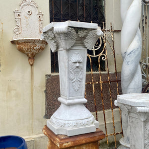 White Marble Plinths with Face of Zeus