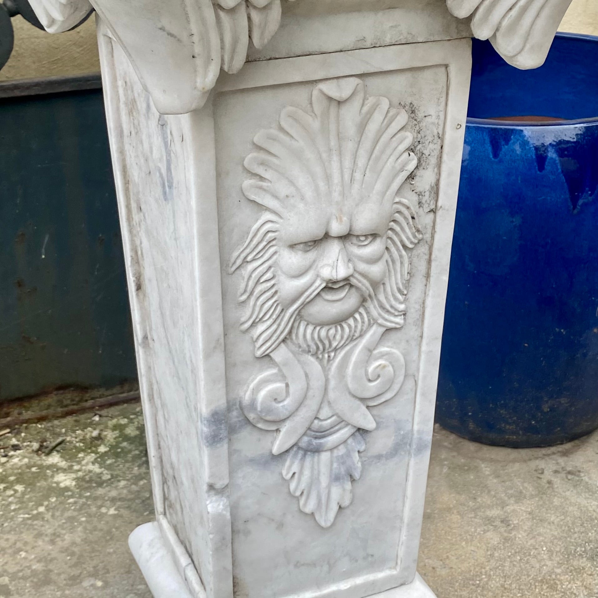 White Marble Plinths with Face of Zeus