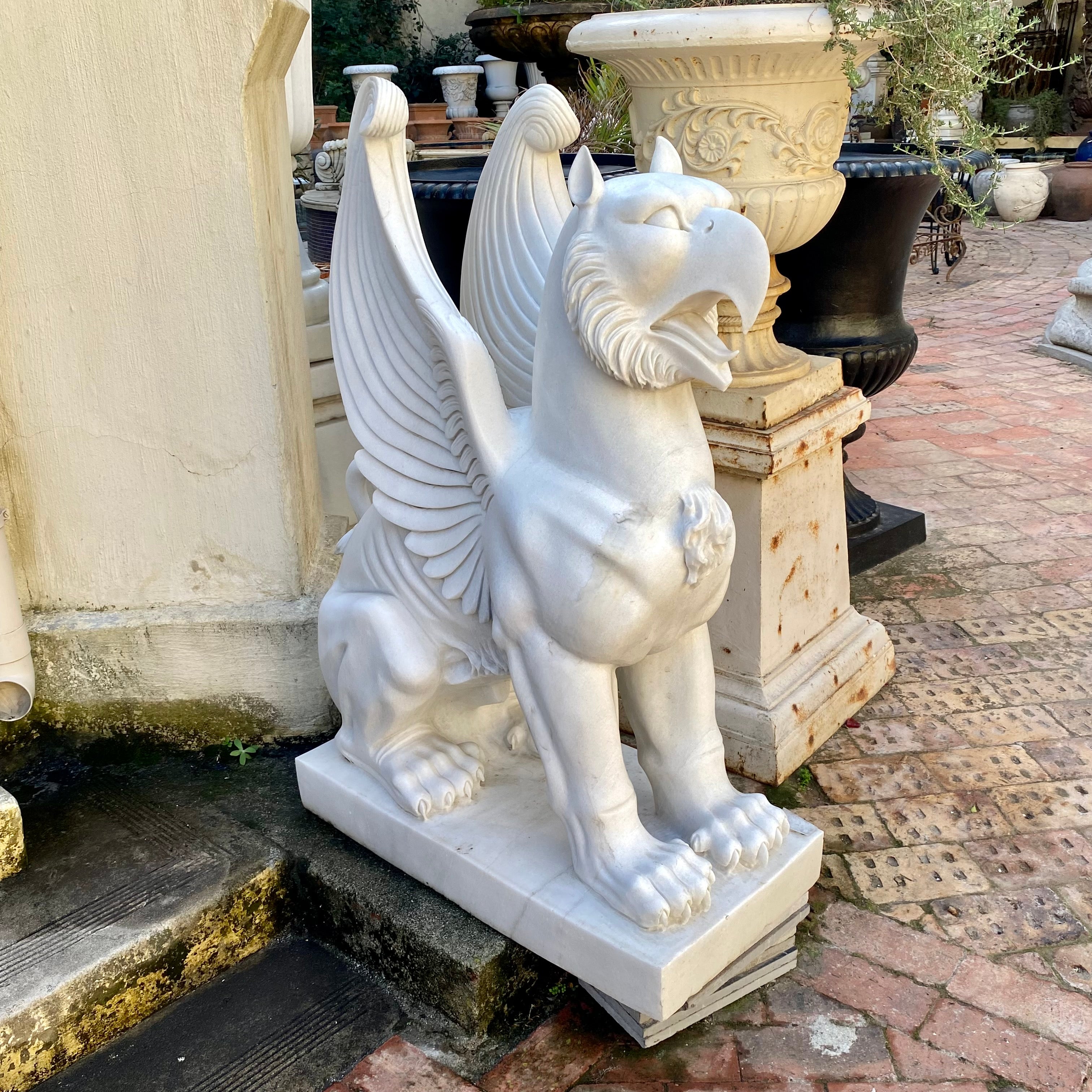 Pair of Carved White Marble Gryphons