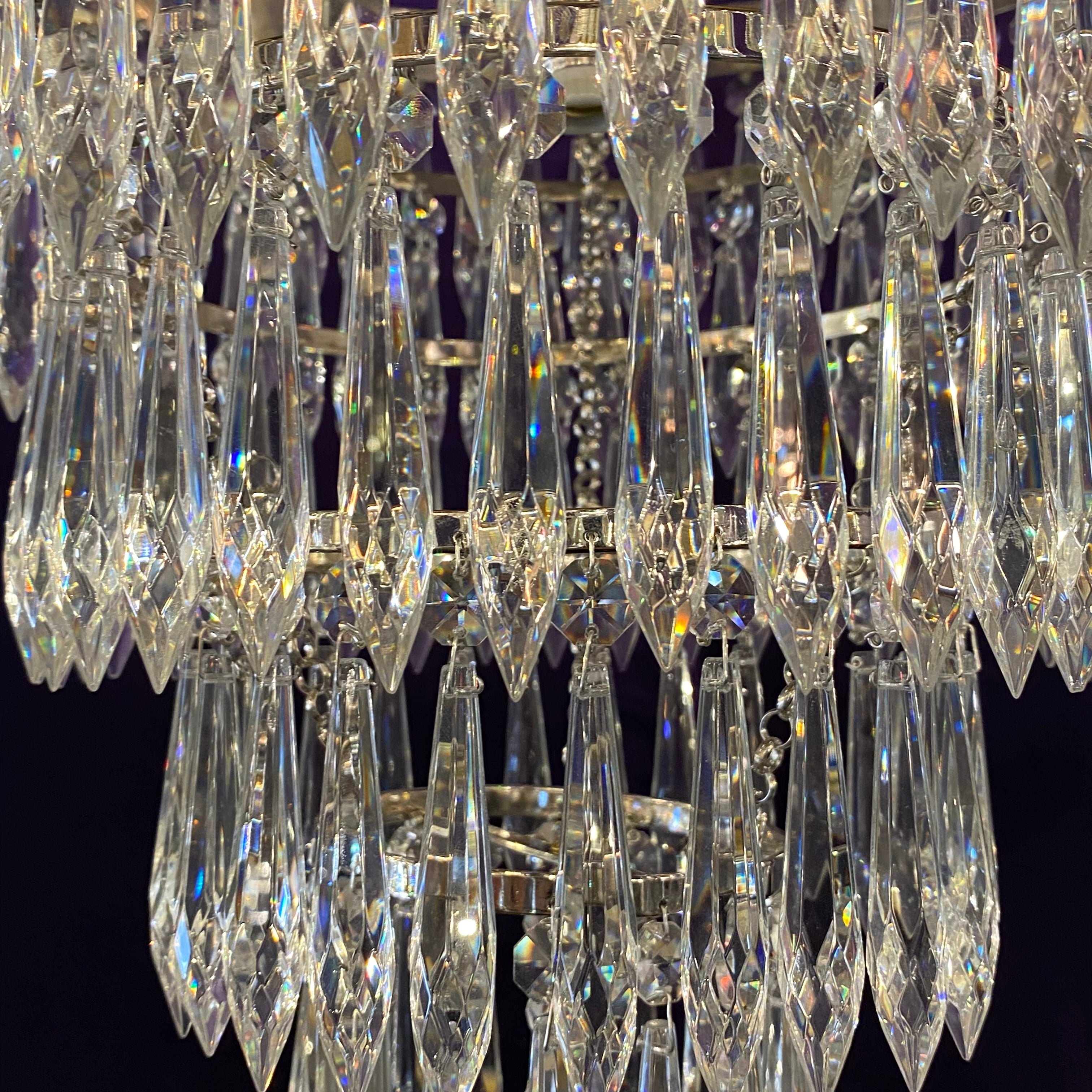 A Nickel and Crystal Waterfall Chandelier